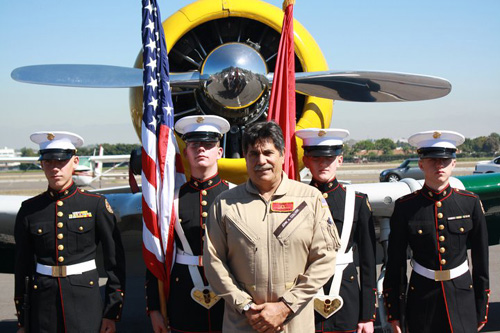 Photo of Pilot John Collver and Color Guard with John's Primary Show Plane, War Dog