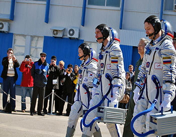 Cosmonauts Walking to their Soyuz Rocket at Baikonur