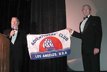 Photo of Bernie Harris presenting 2002 President Mike Smith with an expedition Flag at Night Of High Adventure